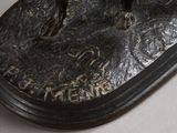 a bronze statue of a horse on a base