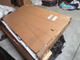 a large cardboard box sitting on top of a pile of boxes