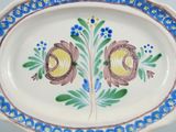 a picture of a decorative plate with flowers on it