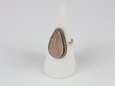 a ring with a tear shaped stone in the middle of it
