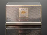 a silver box with a gold label on it