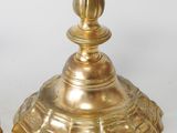 pair of antique brass candlesticks on a white background