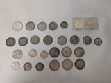 a lot of coins that are on the table