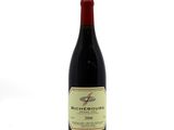 a bottle of wine that is sitting on a table
