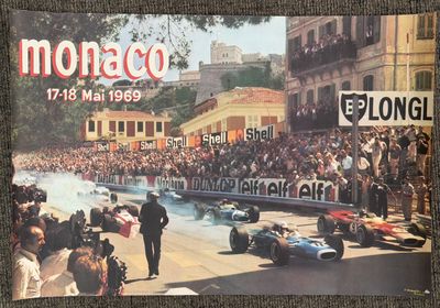 a picture of a poster of a race car going down the street