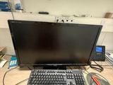 a laptop computer sitting on a desk with a keyboard and mouse