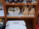 many jars and containers of food on a shelf