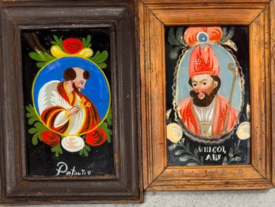 two framed pictures of a man and a woman in religious clothing