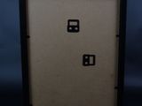 a close up of a black and white picture frame with numbers on it