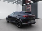 the rear end of a black suv parked in a garage