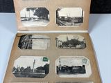 an old photo of an open book with pictures of a train on it