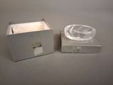a small glass bowl sitting on top of a box