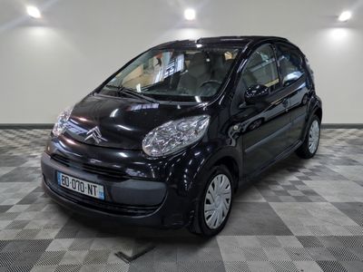 a picture of a small black car on a checkered floor