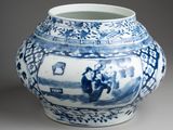 a blue and white vase sitting on a table