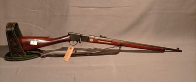 an old gun with a wooden barrel and a wooden handle