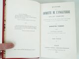 someone is holding a book open to a page with a picture on it