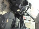 a white van with black seats and a steering wheel