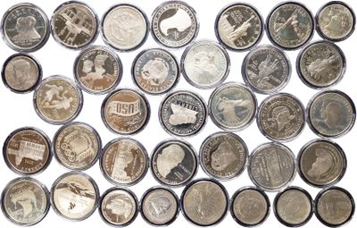 a close up of a bunch of coins on a white surface