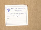 a piece of paper with a note attached to it