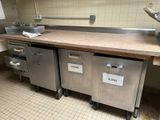 a picture of a commercial kitchen with a lot of counter space