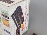 a box that has a game on it and a charger