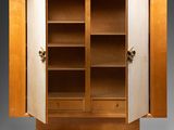 an image of a wooden cabinet with doors open