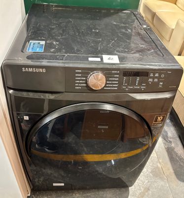 a black washer and dryer sitting in a room