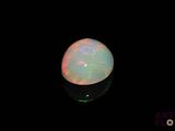 an image of a white oplite in the dark