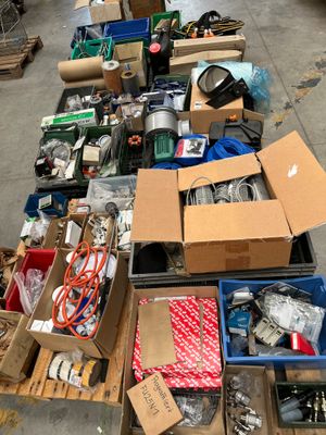 many boxes of assorted items sitting on the floor