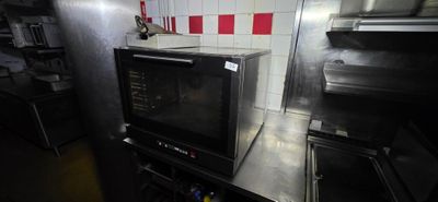 a microwave sitting on top of a counter in a kitchen