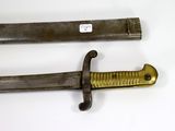 pair of old and worn swords on a white surface