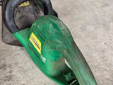 a chainsaw that is laying on the ground