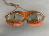 a pair of goggles and a hat sitting on a table