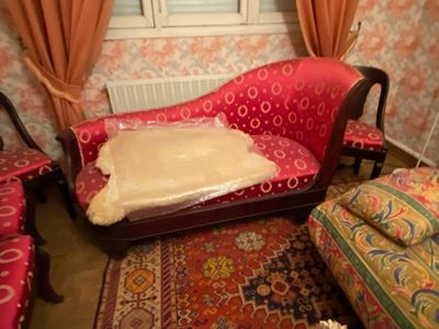 a couch with a pillow on it in a living room