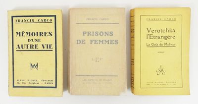 three books sitting on top of each other on a white surface