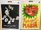 two posters on the wall of a store