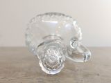 a glass vase that is sitting on a table