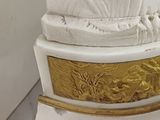 a statue of a shell on top of a pedestal
