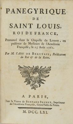 un vieux livre sur lequel figure l'image en noir et blanc d'un oiseau
