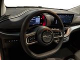 the interior of a car with a steering wheel, dashboard, and display screen