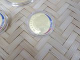 three coins sitting on top of each other on a table