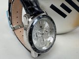 a watch that is sitting on top of a cup