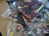 a box full of dolls and other items on the table