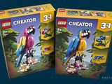 two boxes of lego creator toys with a parrot on top of them