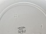 an image of a white plate with a picture of a dog on it