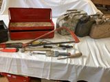many tools on a table with a white table cloth