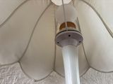 a close up of a white umbrella with a light on it