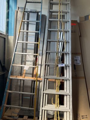 two ladders that are next to each other in a room