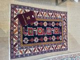 a rug on the wall with a passport on top of it