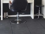 a large room with chairs and mirrors in it
